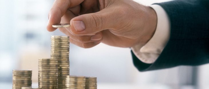 Businessman is stacking coins